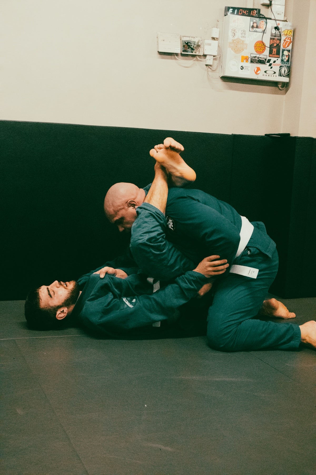 a man is doing a backlock on another man
