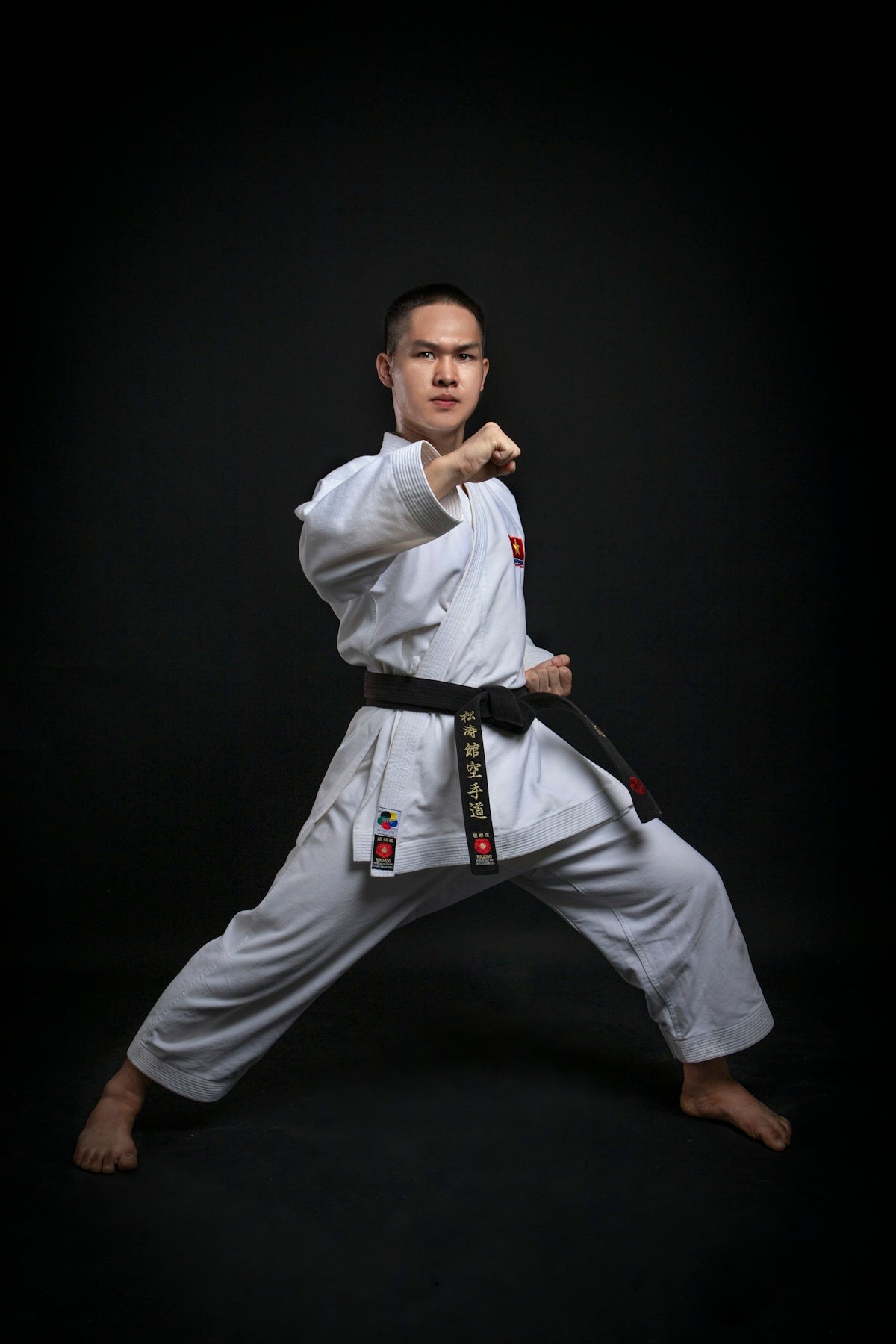 a man in a karate uniform