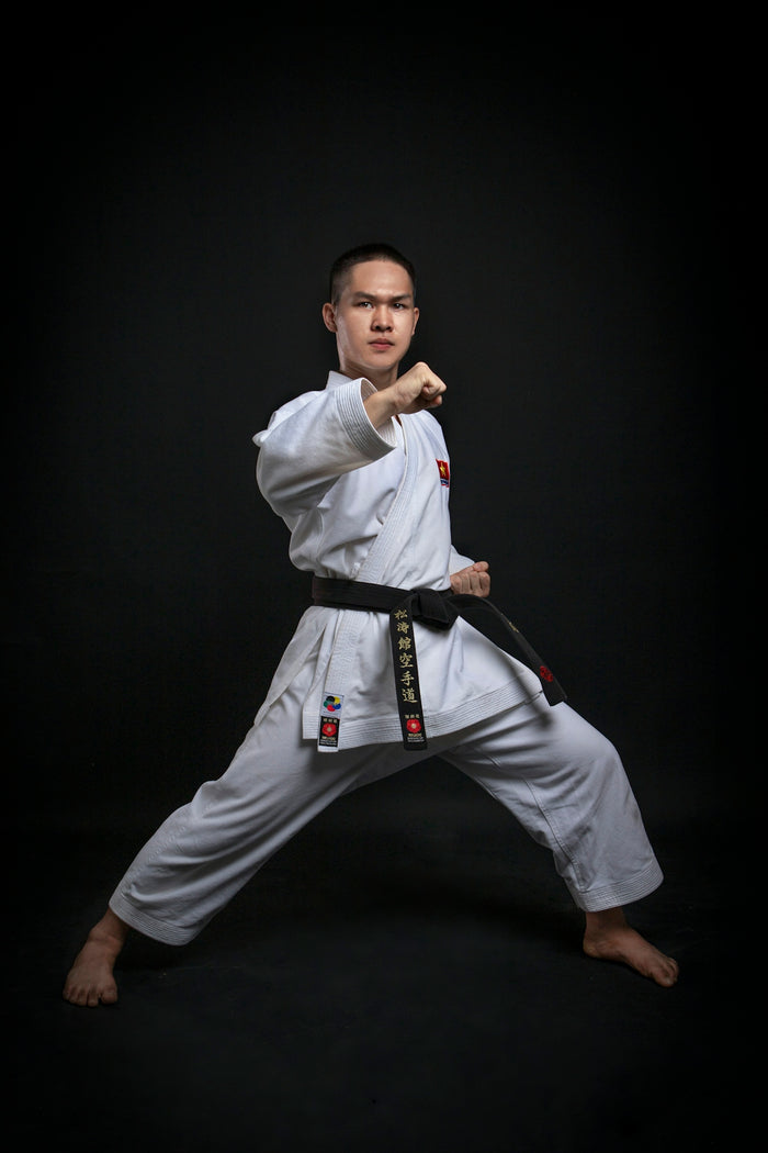 a man in a karate uniform