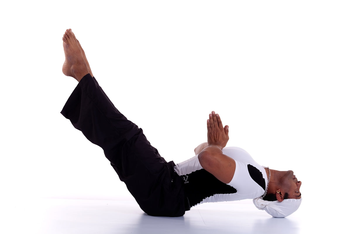 A man in a black and white shirt doing a handstand